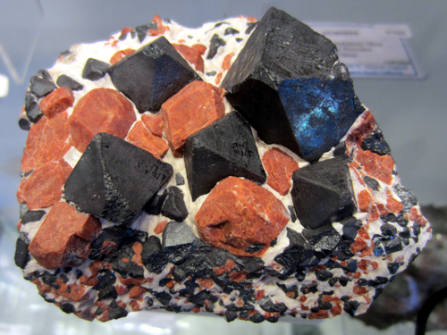 Willemite & Franklinite crystals, Franklin Mine, 15 cm across (photo © kristalle.com, Tucson Show 2008) 