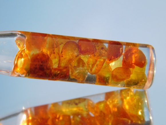 Fully prepared, gem grade amber pendant shows off a warm glow in sunlight.