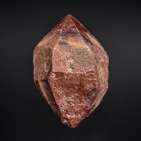 An example of a fairly "typical" Pecos Valley Diamond - a doubly terminated prismatic crystal. The red coloration is also fairly common. Crystal is 5.9cm.