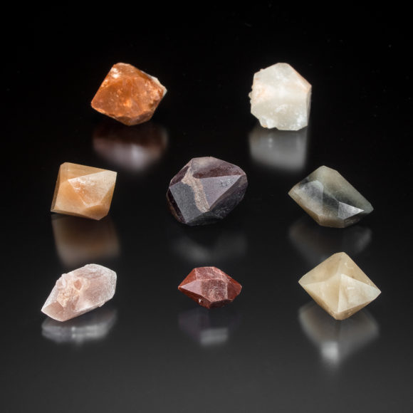 A grouping of Pecos Valley Diamonds showing some of the range of coloration in the quartz crystals. Center crystal is 2.5cm.